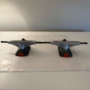 Tensor Silver and Orange Skateboard Trucks